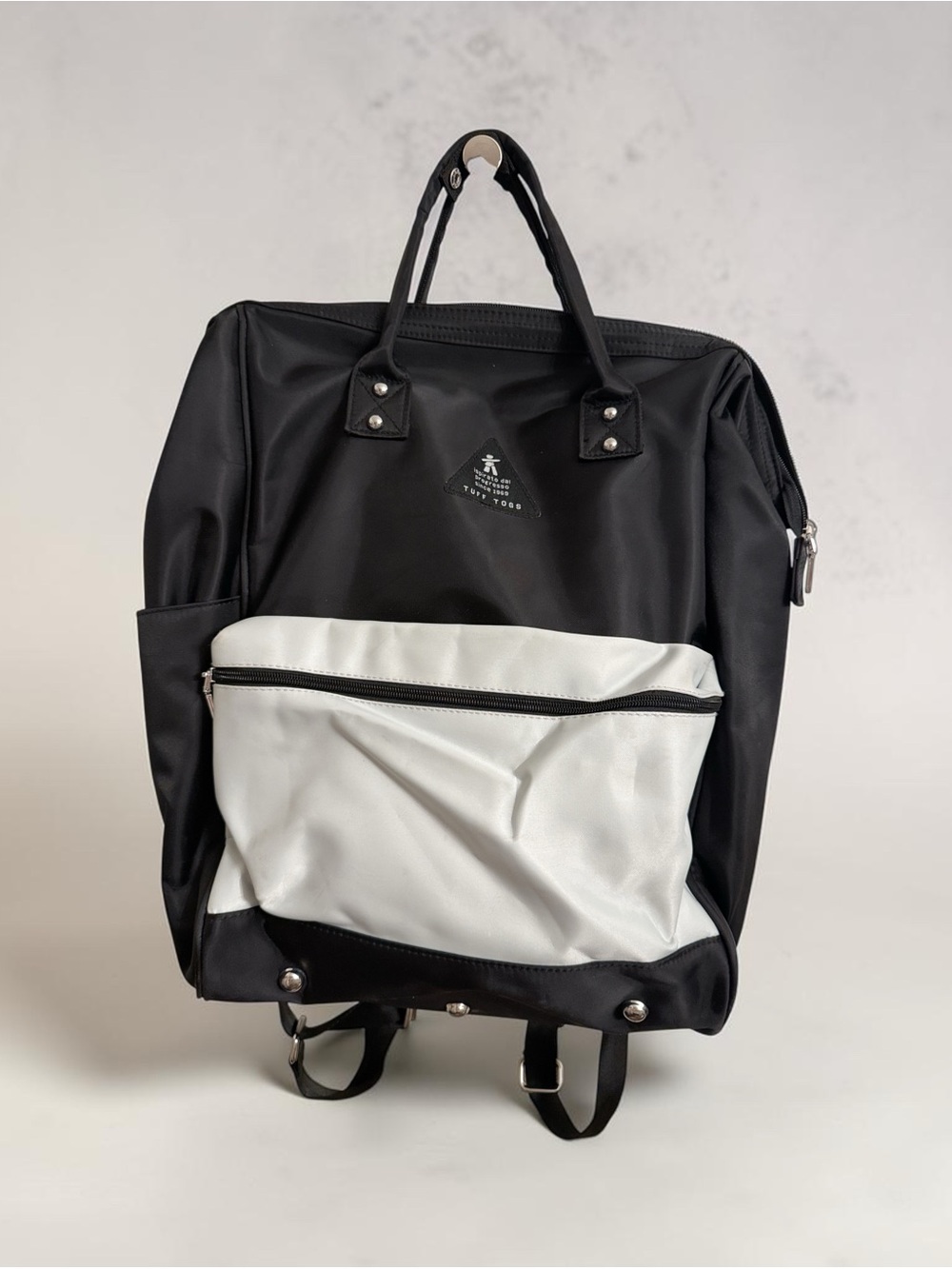 Tuff Toggs Backpack approximately 12” wide x 6” deep x 18” tall.